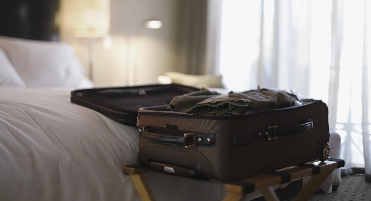Open luggage in a hotel room