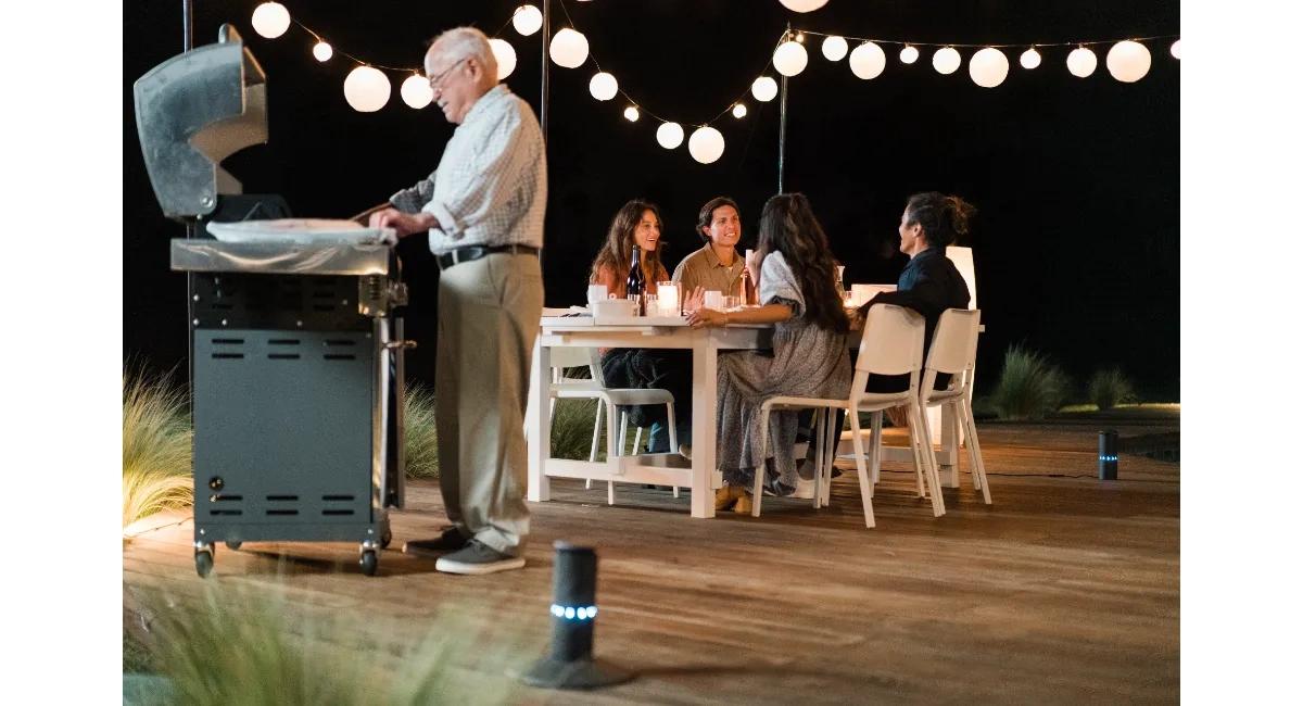 Family dining in backyard