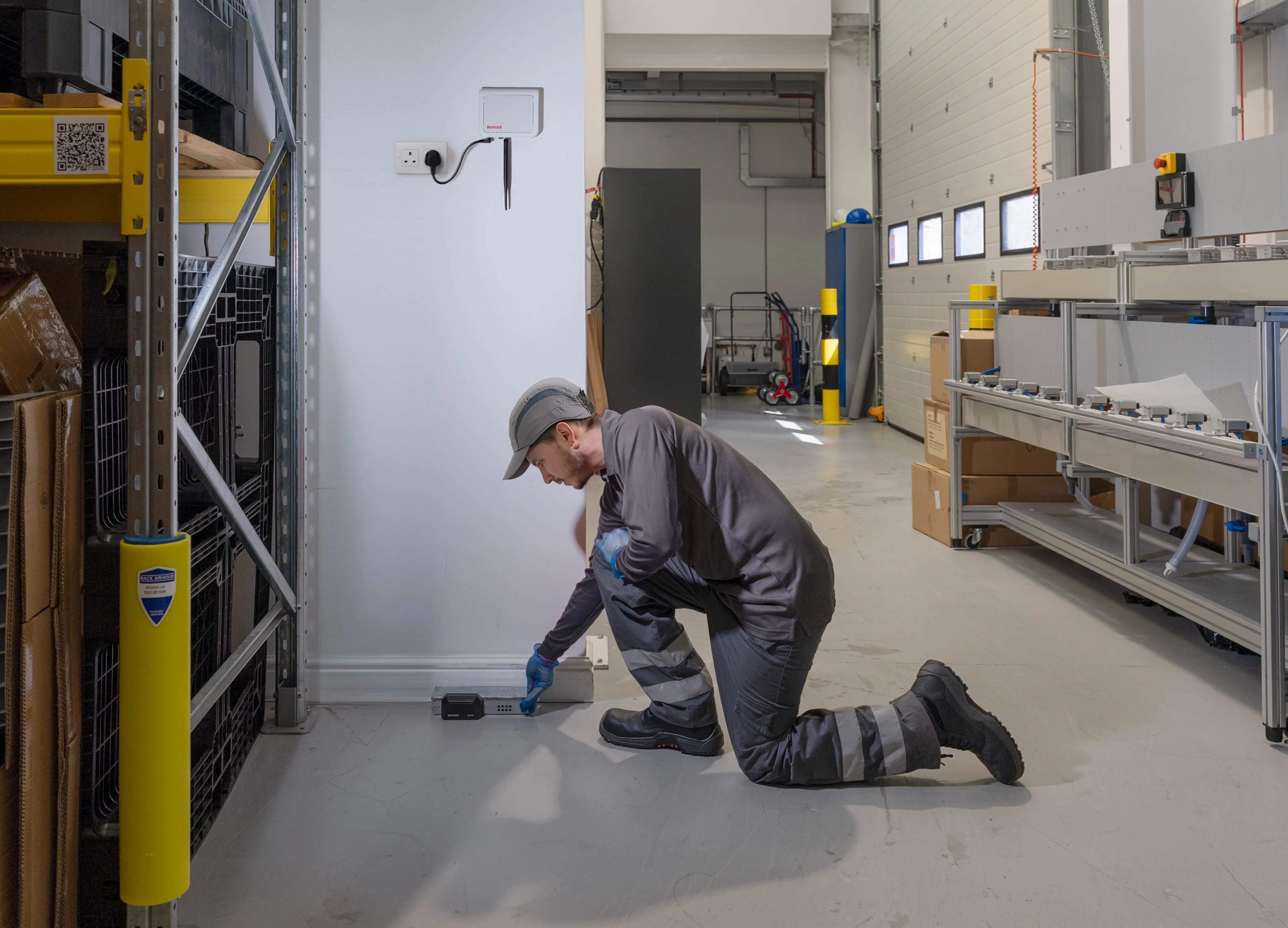 A technician installing PestConnect