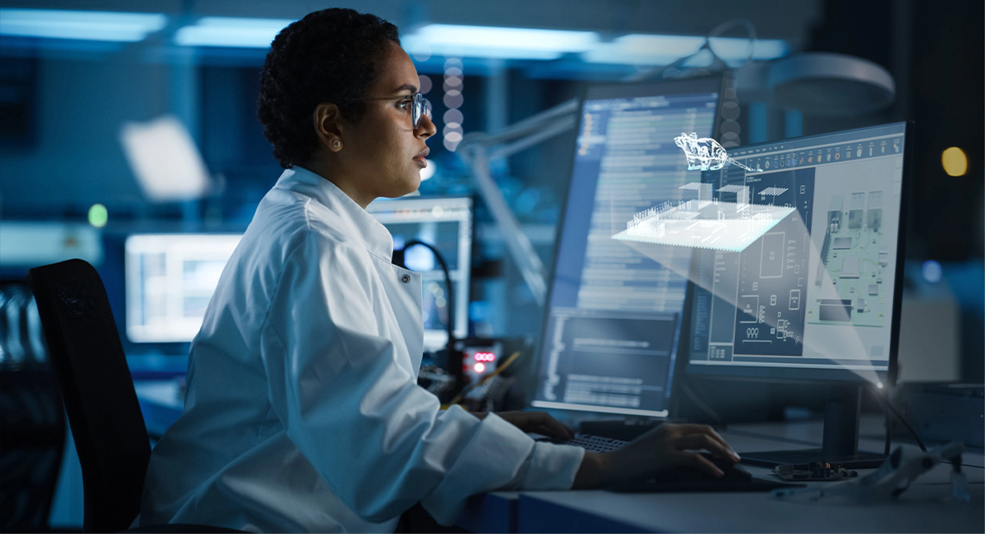 A pest control analyst reviews AI-driven rodent activity data on a screen .