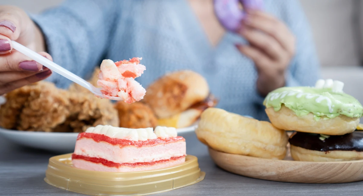 A woman eating sweet treats