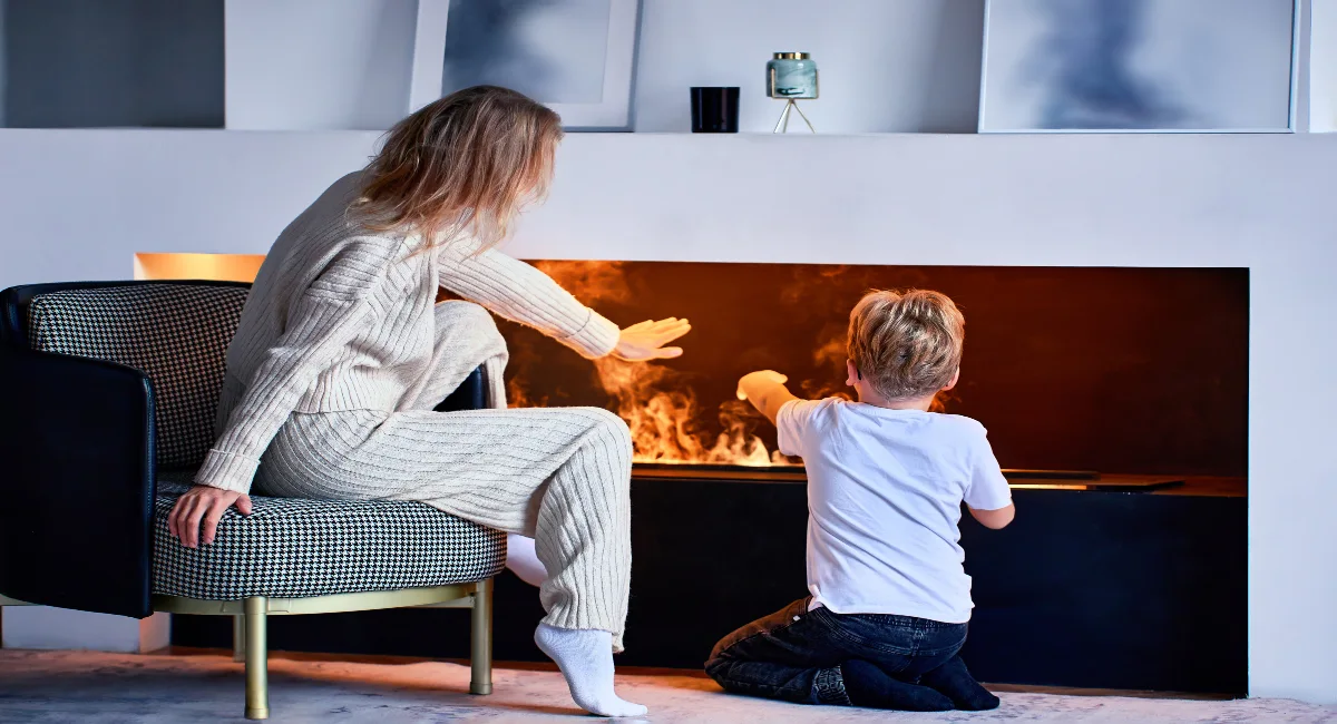 Family of two sitting near fireplace