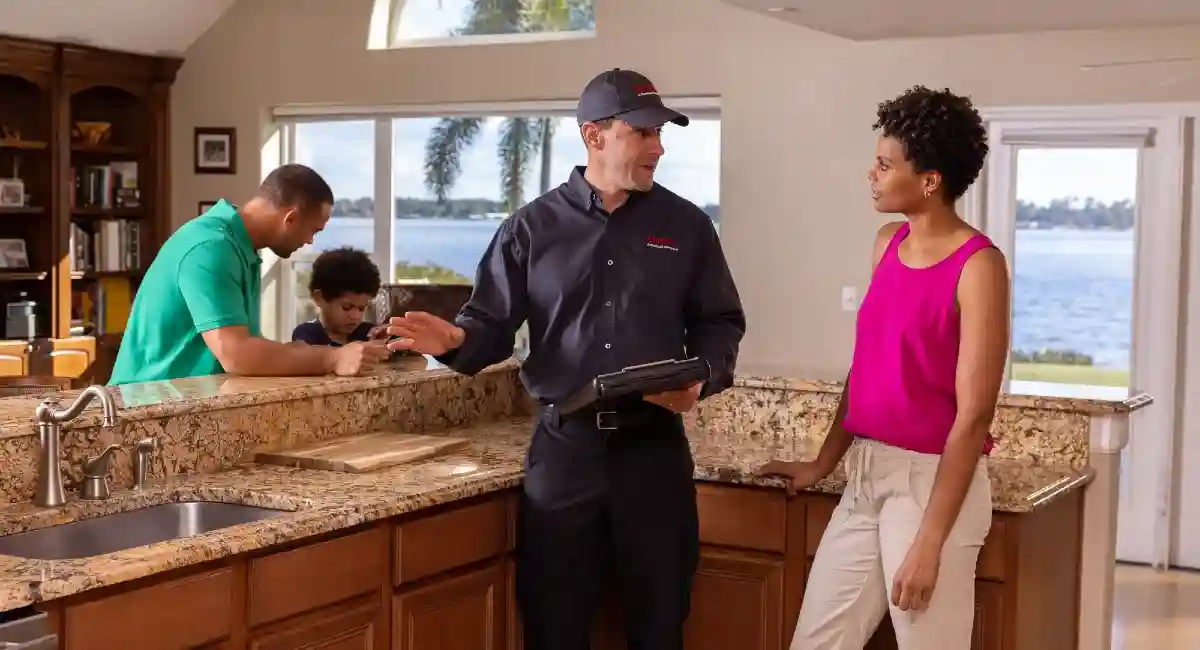 Colleague and customer in the kitchen discussing