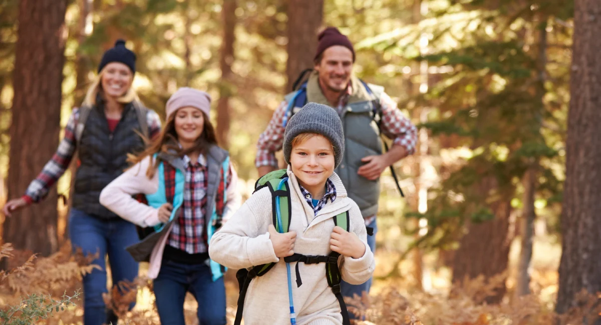 Family hiking during fall